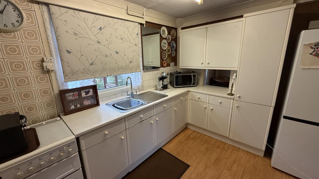 Lot: 160 - VACANT SEMI-DETACHED HOUSE REQUIRING MODERNISATION - Internal image of kitchen from hallway